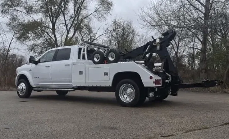 Oshawa wrecker equipment securing damaged vehicle
